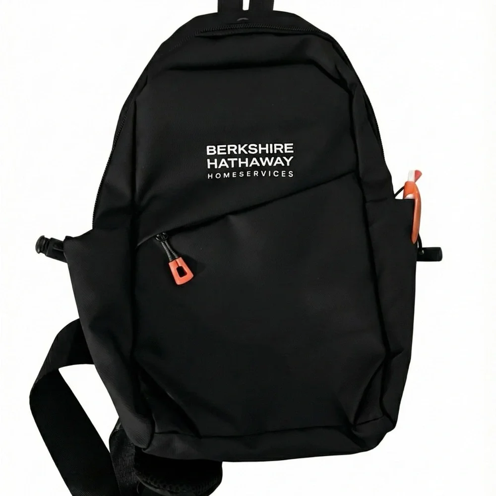 Waterproof Travel Sling Bag- Unisex. Black with Orange accents.